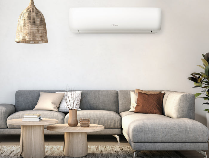 A modern living room with a Hisense wall-mounted air conditioner unit