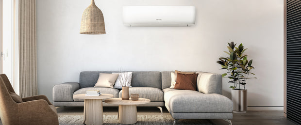 A modern living room with a Hisense wall-mounted air conditioner unit