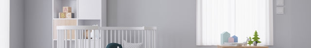 Light gray baby room with a wall-mounted air conditioner unit